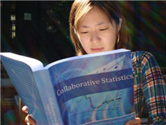 student reading textbook