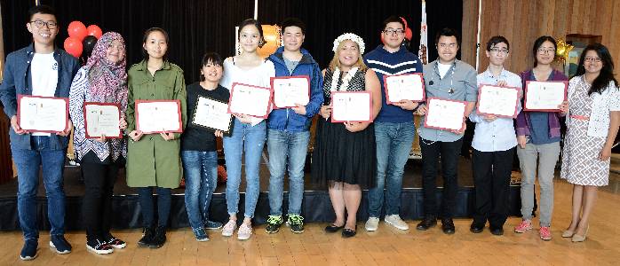 Students holding certificates