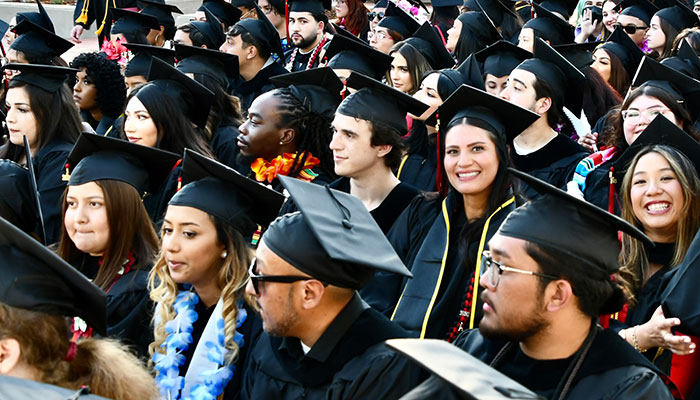 Group of students in cap and gown at graduation