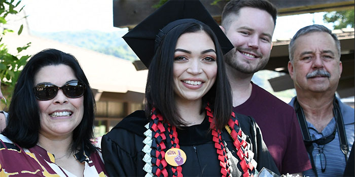 graduate with family