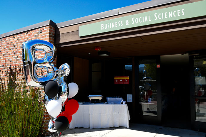 outside office door with table,  balloons