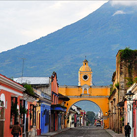 colorful city scene with mountain backdrop