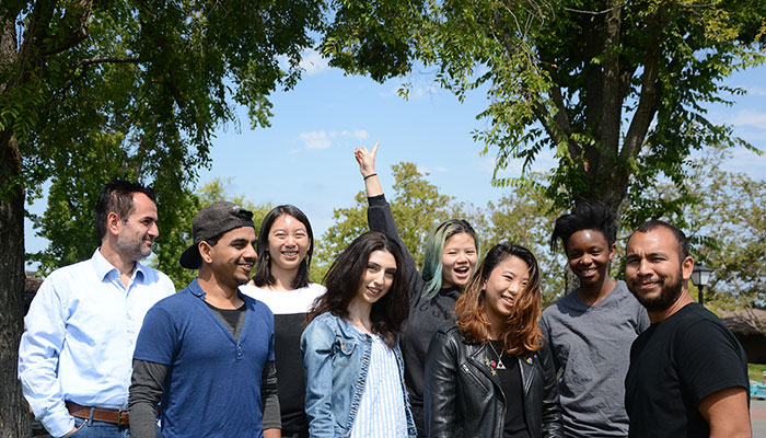 Group of 10 students under tree