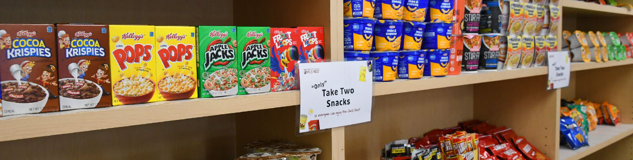 shelves with cereal and other dry food