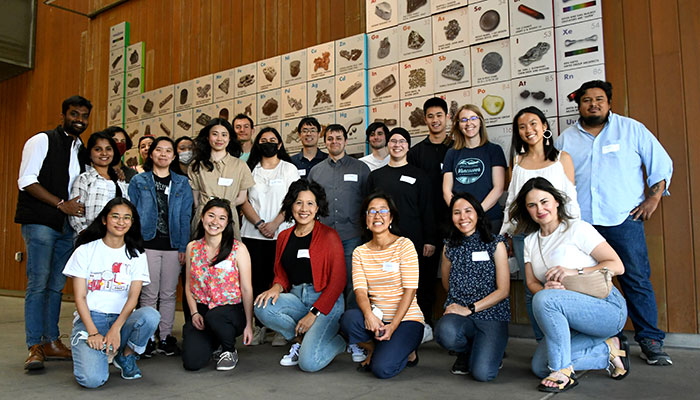 Group of students in periodic table mural