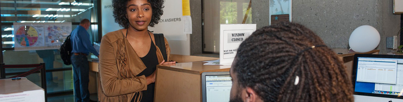 Woman in line to talk with instructor